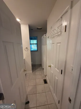 a view of a bathroom with a sink and shower