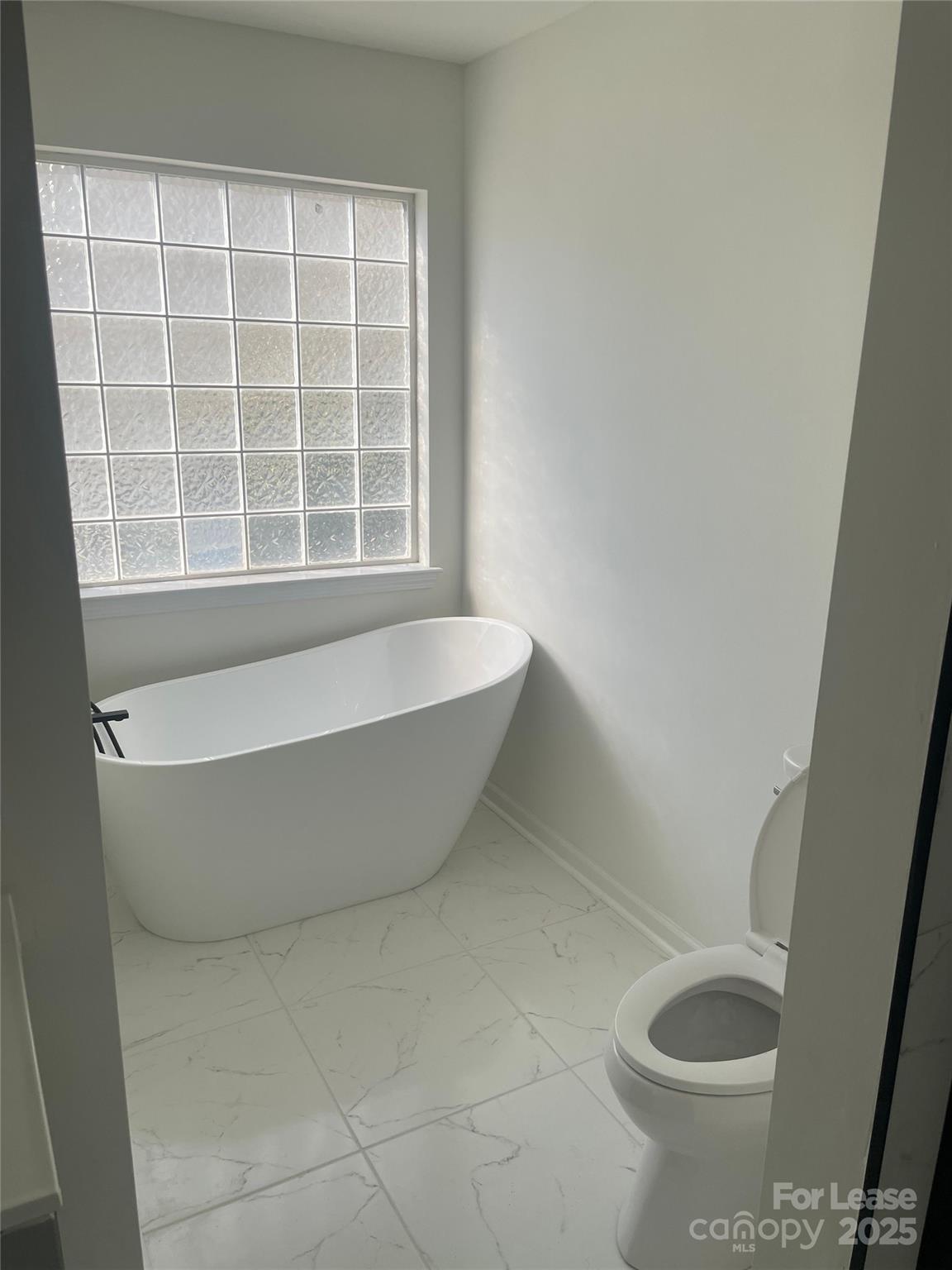 242 Amir Circle Matthews, NC 28105 - Photo 11 of 22 a view of a bathtub in a bathroom