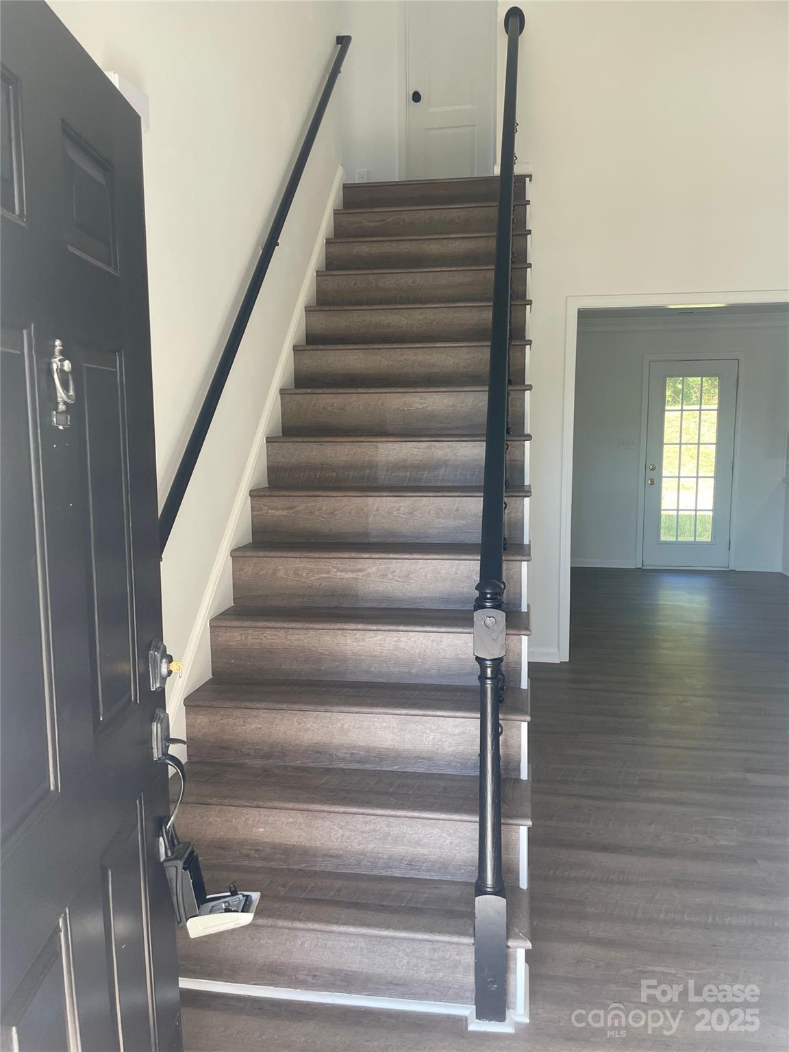 242 Amir Circle Matthews, NC 28105 - Photo 14 of 22 a view of entryway and hall with wooden floor