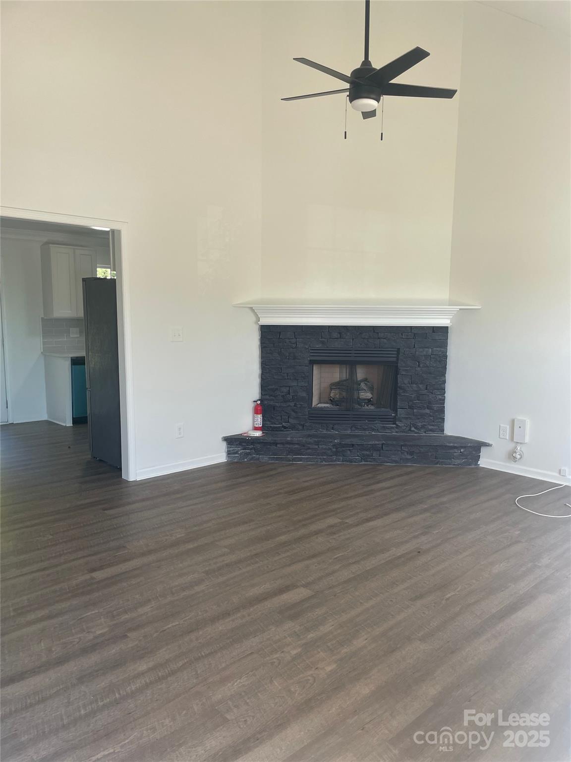 242 Amir Circle Matthews, NC 28105 - Photo 15 of 22 a view of empty room with wooden floor and fireplace