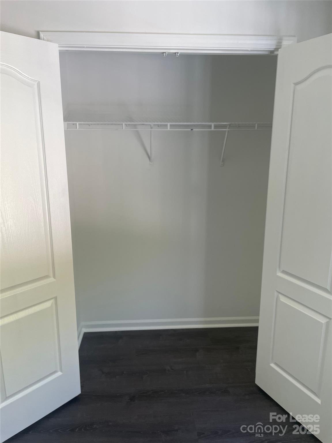 242 Amir Circle Matthews, NC 28105 - Photo 3 of 22 a view of an empty walk in closet