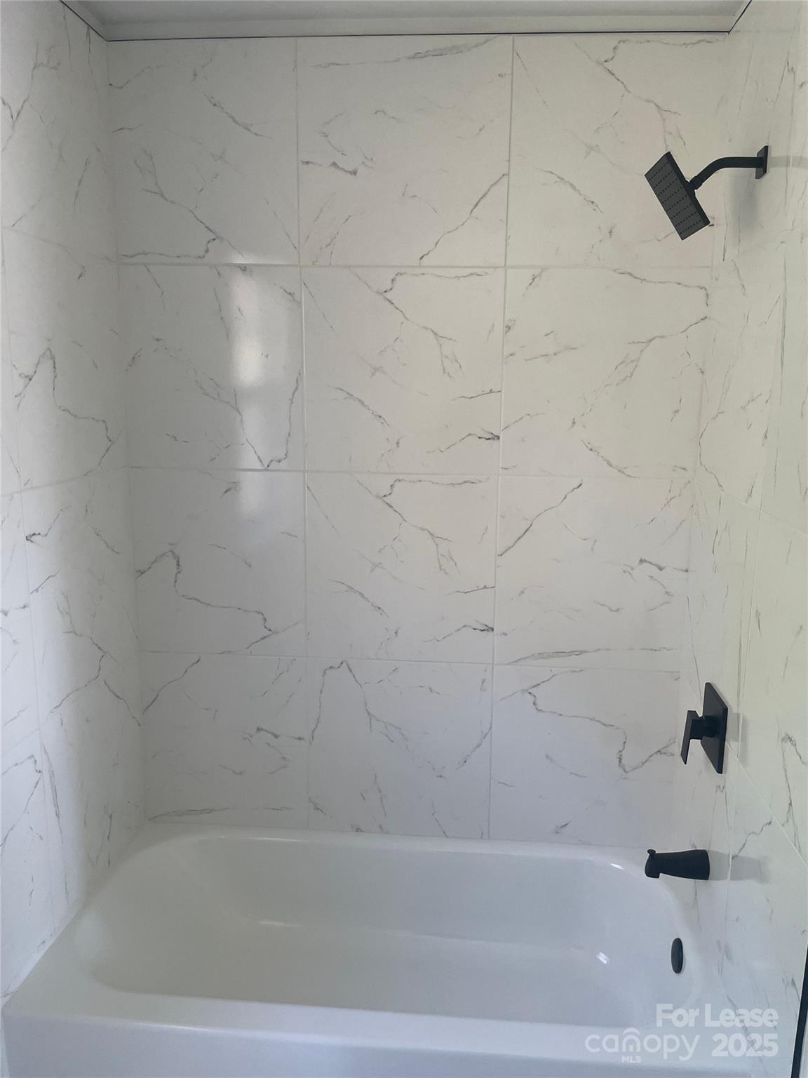 242 Amir Circle Matthews, NC 28105 - Photo 5 of 22 a bathroom with a bathtub