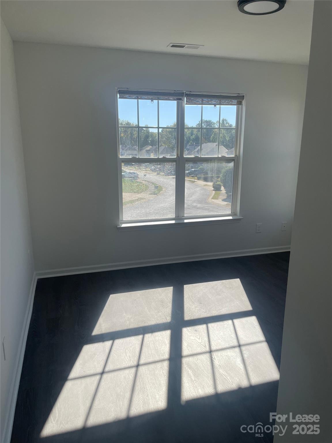 242 Amir Circle Matthews, NC 28105 - Photo 8 of 22 a view of wooden floor in a room