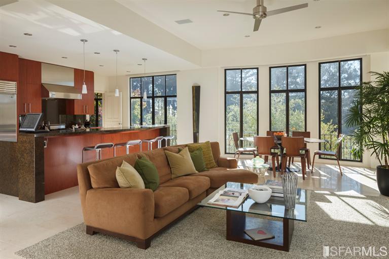 2330 Lyon Street San Francisco, CA 94115 - Photo 5 of 27 Great Room: Views of Presidio Park, Palace of Fine Arts, and San Francisco Bay. Large sunny Kitchen/Family room/Dining area all combined into one free-flowing space with high ceilings and ‘floor-to-ceiling’ windows. With no walls, this centralized area of the home has two dining options, a casual space for entertaining & watching TV, plus a big Chef’s kitchen. Radiant-heated limestone floors complement the granite breakfast bar and counters, both displaying the finest craftsmanship.