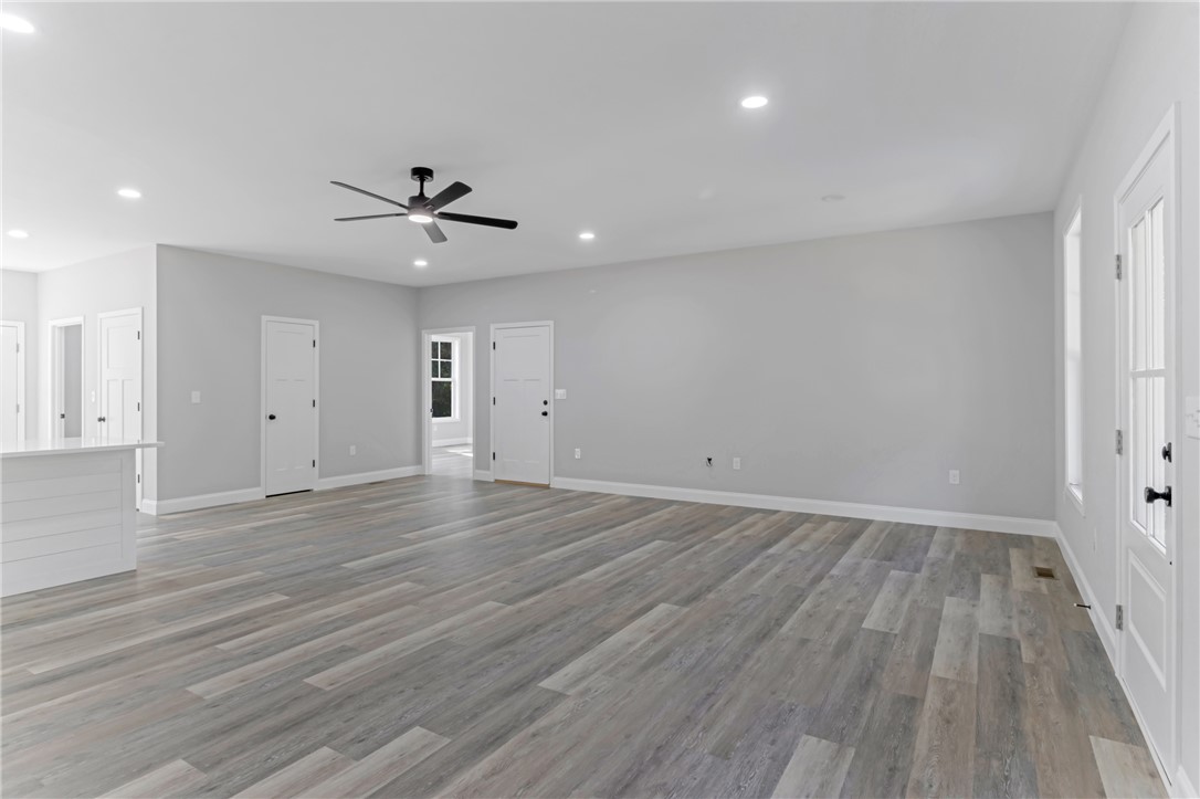 1115 Marshall Road Anderson, SC 29626 - Photo 7 of 35 Gleaming vinyl floors and recessed lighting define this spacious open living area.