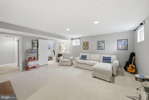 a living room with furniture and white walls