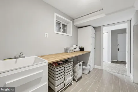 a room with a sink and a mirror
