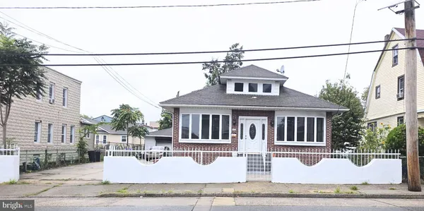 a front view of a house with yard