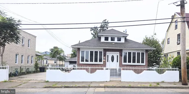 a front view of a house with yard