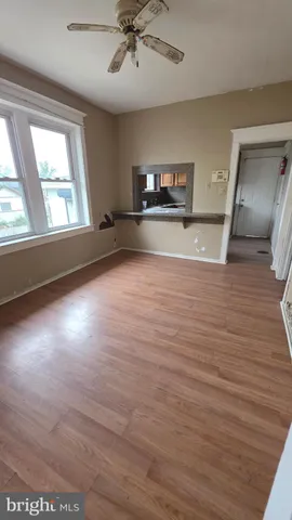a kitchen with granite countertop wooden cabinets a sink and a window
