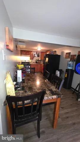 a bedroom with a bed and a flat tv screen on the dresser