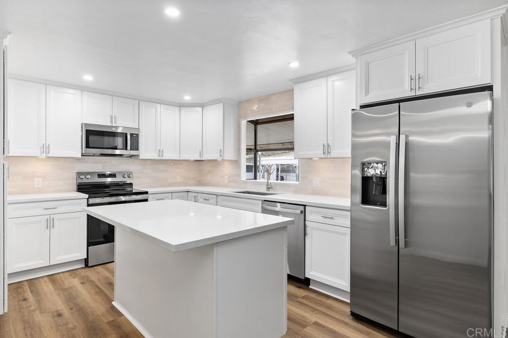 7467 Mission Gorge Road, Unit SPC 10 Santee, CA 92071 - Photo 14 of 44 a kitchen with a refrigerator sink and microwave