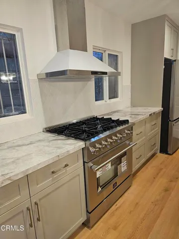 a kitchen with a stove and a refrigerator