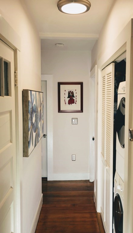 254 Upland Road, Unit 2 Cambridge, MA 02140 - Photo 20 of 34 a view of a hallway with wooden floor and closet