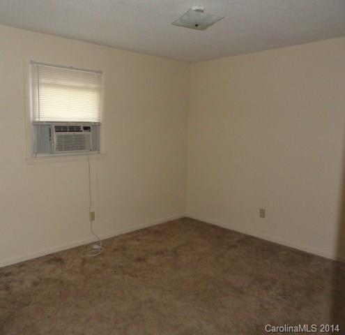 562 Sharon School Road, Unit 3 Statesville, NC 28625 - Photo 5 of 6 an empty room with a empty space and window