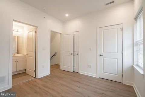 a view of a bathroom with wooden floor