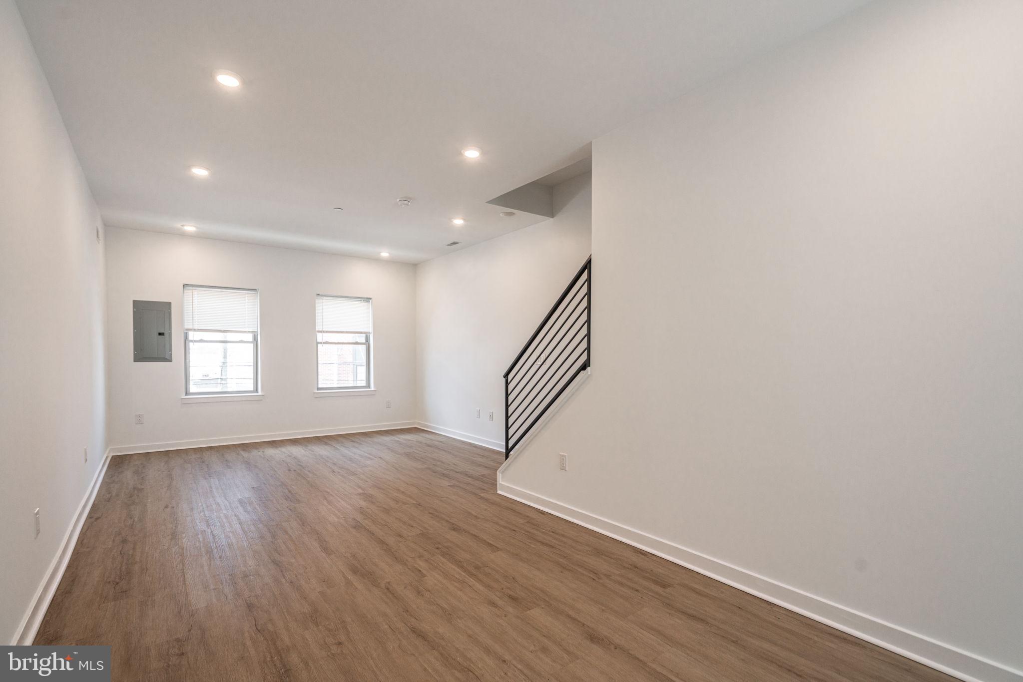 1105 South 27th Street Philadelphia, PA 19146 - Photo 10 of 19 a view of an empty room with wooden floor and a window