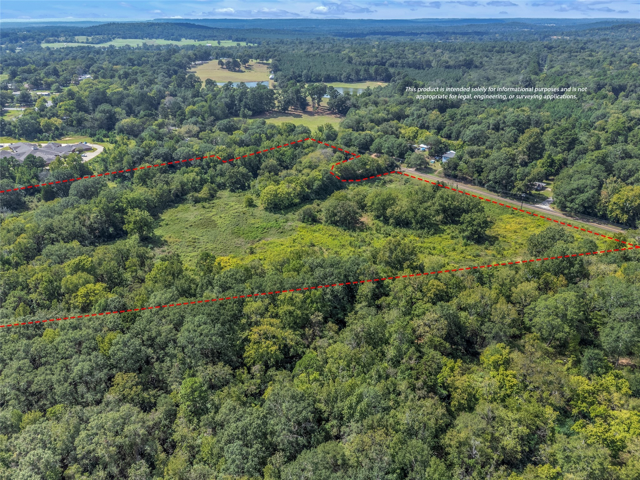 Tbd Crockett Street Rusk, TX 75785 - Photo 2 of 17 an aerial view of a houses with a lush green hillside