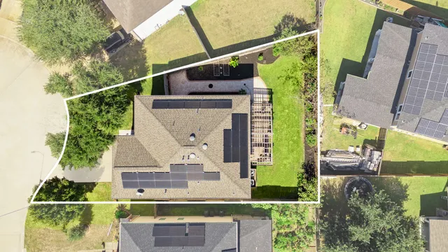an aerial view of residential house with outdoor space