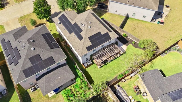 an aerial view of a house with a garden