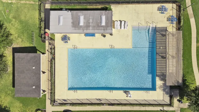 a view of a brick house with a small park