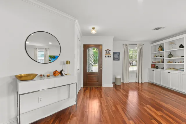 a view of a living room and wooden floor