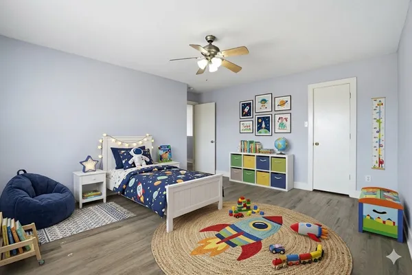 a bedroom with a bed and a book shelf