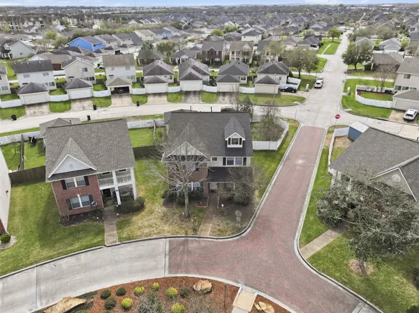 an aerial view of a house with a swimming pool