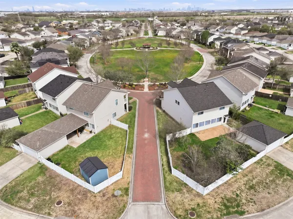 an aerial view of residential houses with outdoor space