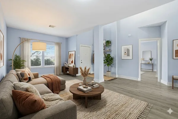 a living room with furniture and a large window