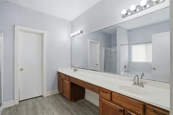 a bathroom with a sink double vanity and a mirror