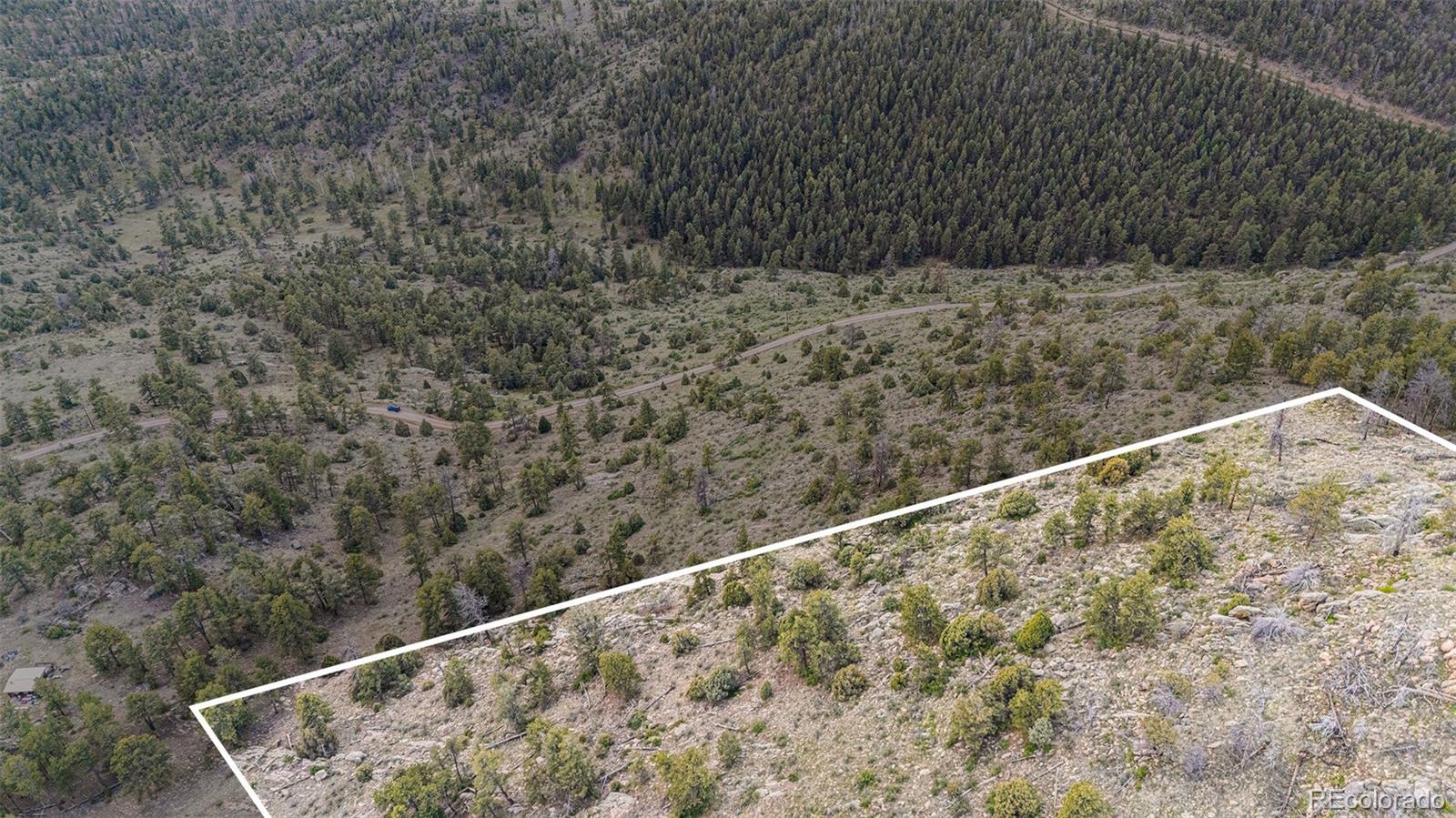 14336 South Wamblee Trail Conifer, CO 80433 - Photo 4 of 12 a view of wooden floor and a fence