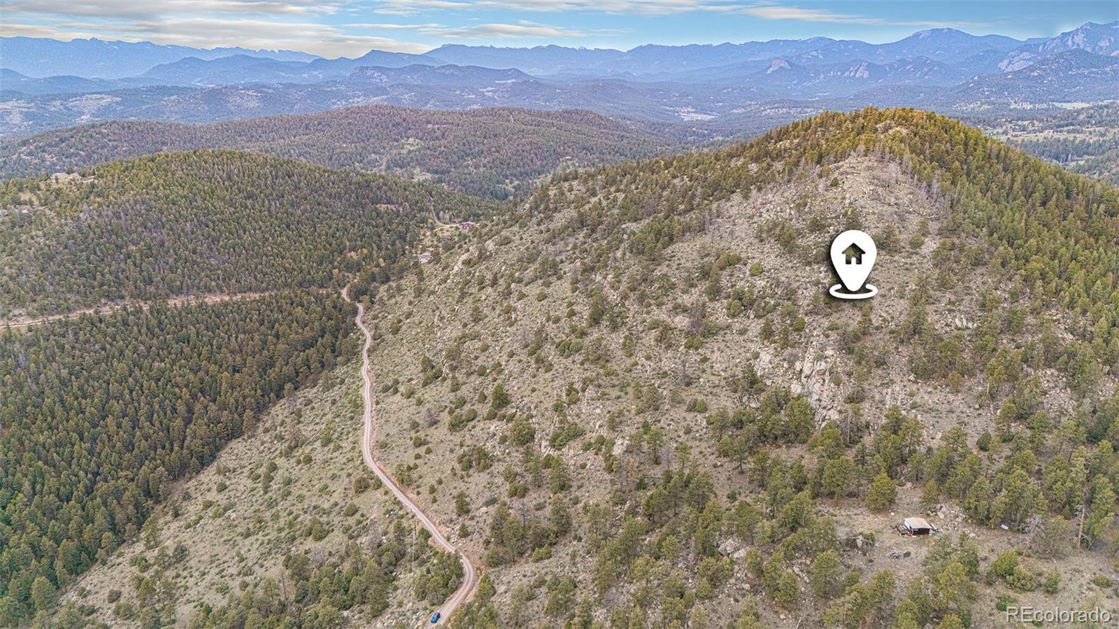 14336 South Wamblee Trail Conifer, CO 80433 - Photo 8 of 12 a view of a sky from a mountain