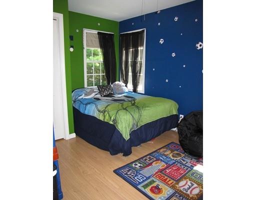 178 Palmer Road Brimfield, MA 01010 - Photo 10 of 17 a bed sitting in a bedroom next to a window
