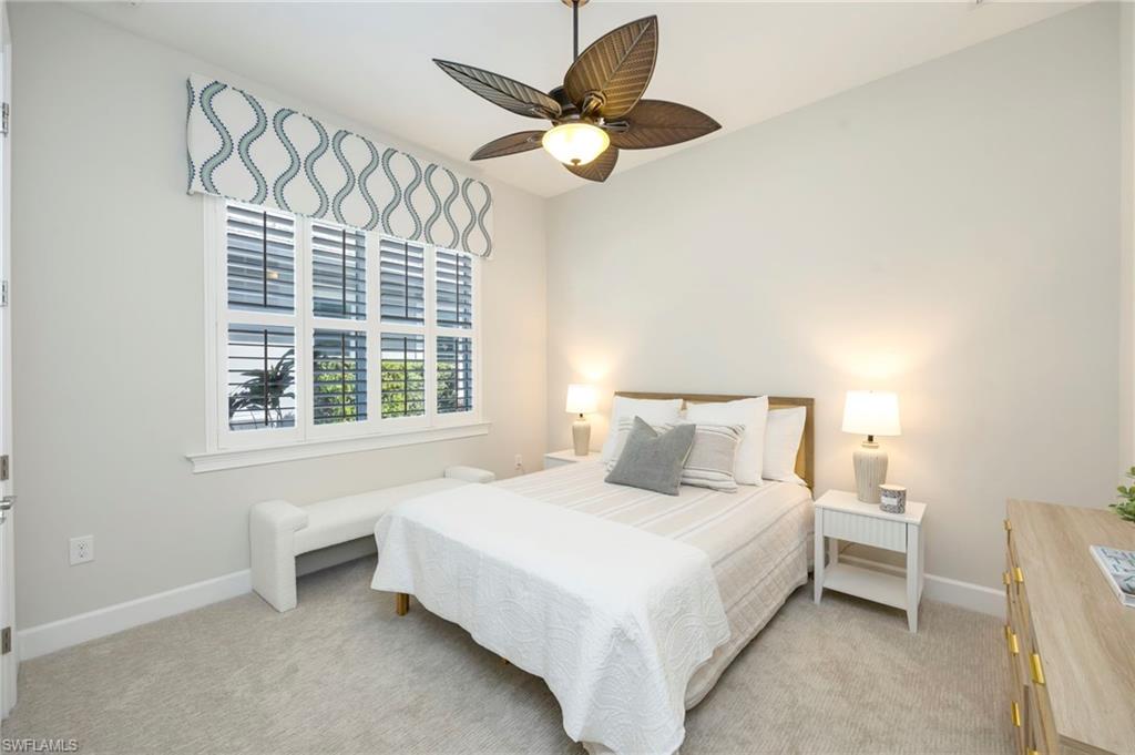 6466 Warwick Avenue Naples, FL 34113 - Photo 13 of 43 a bedroom with a bed and a large window