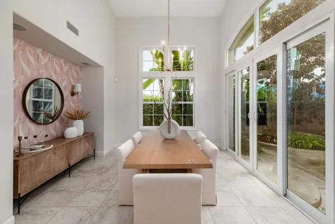 a living room with furniture a window and a fireplace