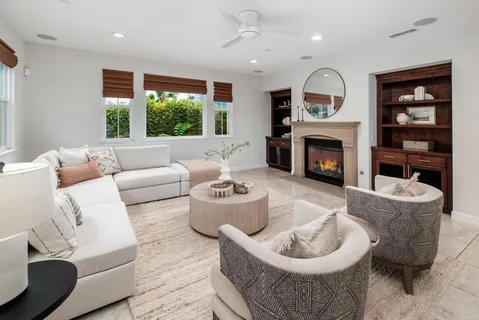 a large kitchen with a table and chairs in it