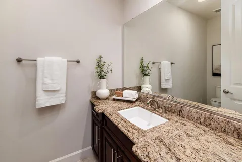 a utility room with sink dryer and washer
