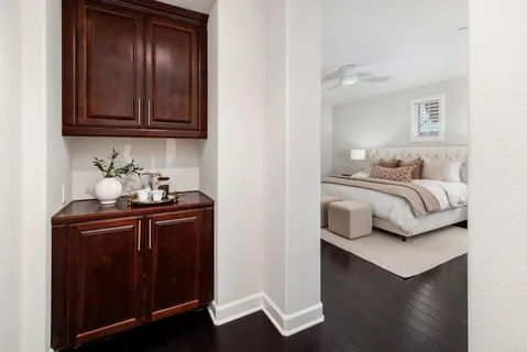 a bedroom with bed and a couch