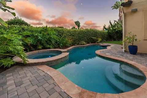 a view of a swimming pool with a backyard