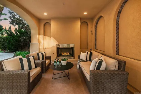a living room with furniture fireplace and a flat screen tv