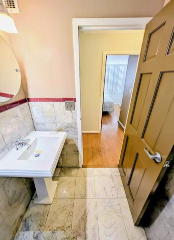 a view of living room with furniture and wooden floor