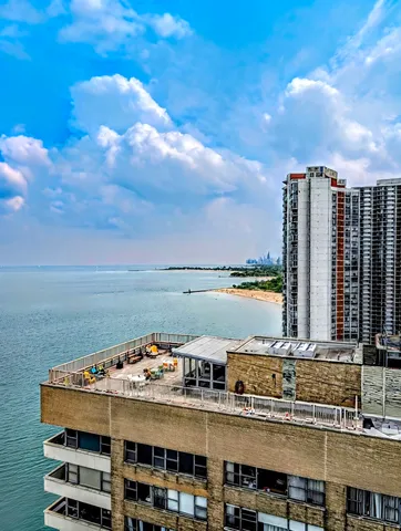 a view of a lake with building in front of it