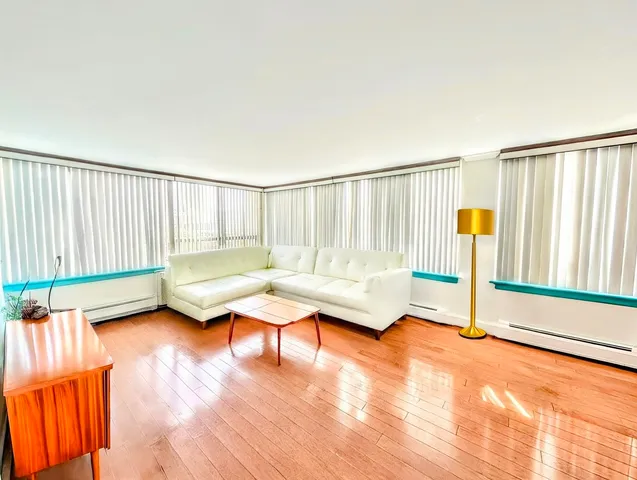 a living room with furniture and a table