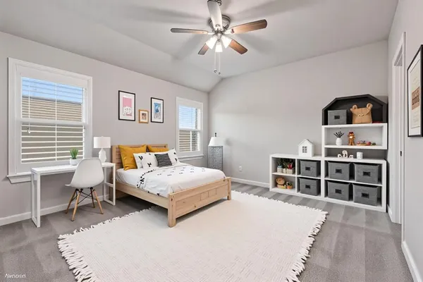 a bedroom with a bed wooden floor and window