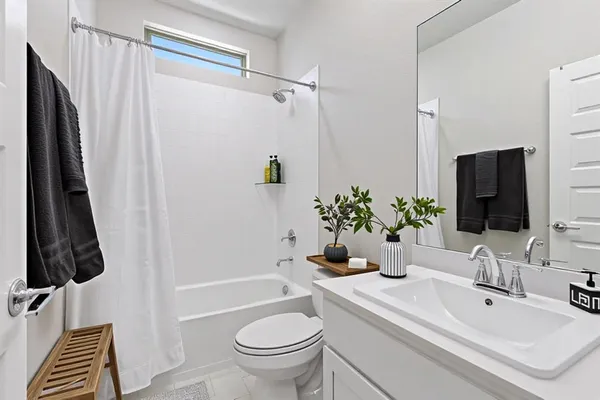 a utility room with cabinets washer and dryer
