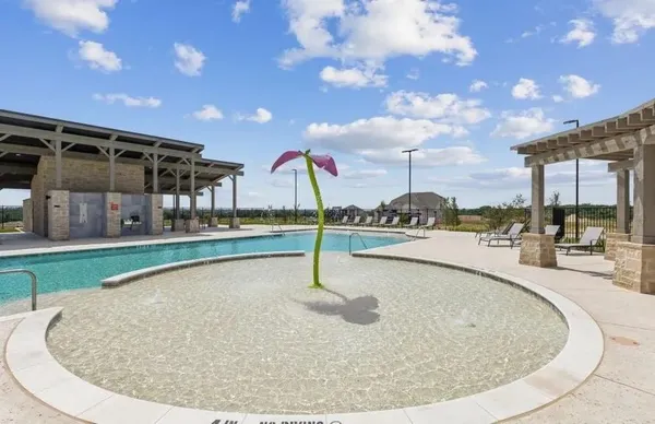 an aerial view of a house with a garden and pool