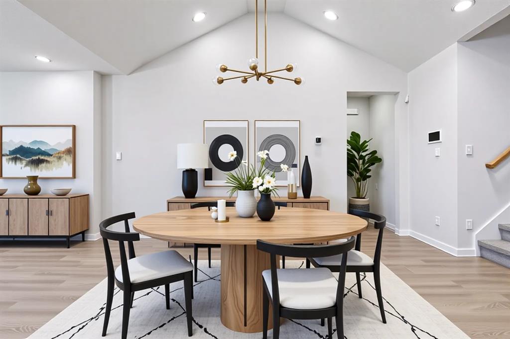 2012 Edgewater Street Celina, TX 75009 - Photo 9 of 31 Dining space with lofted ceiling, a chandelier, light wood-style flooring, recessed lighting, and stairs