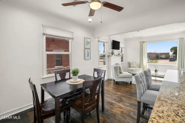 a view of a dining room with furniture window and wooden floor