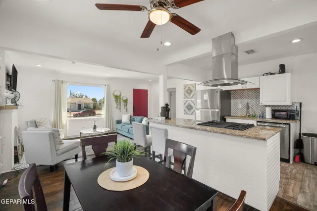 a kitchen with a dining table and chairs